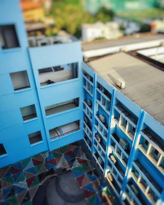 an aerial view of a blue building